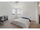 Bedroom with a ceiling fan and natural light shining through the two windows at 13208 Leggett Aly, Orlando, FL 32827