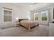 Inviting bedroom featuring neutral colors, plush carpeting, and ample natural light at 13208 Leggett Aly, Orlando, FL 32827
