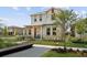 Charming two-story home with a cozy front porch and well-manicured lawn in a Gathering-friendly neighborhood at 13208 Leggett Aly, Orlando, FL 32827