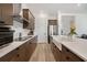 Contemporary kitchen featuring stainless steel appliances, ample counter space, and stylish cabinetry at 13208 Leggett Aly, Orlando, FL 32827