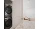 Conveniently located laundry area with modern, stacked washer and dryer units at 13208 Leggett Aly, Orlando, FL 32827