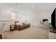 Inviting living area with plush seating, a desk, and ample natural light at 13208 Leggett Aly, Orlando, FL 32827