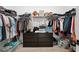Walk-in closet with custom shelving, ample storage space, and organizational features at 13208 Leggett Aly, Orlando, FL 32827