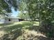 Backyard featuring mature trees and well-maintained lawn at 1326 Wildcat Ct, Apopka, FL 32712