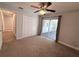 Bedroom with carpet, ceiling fan and sliding glass doors leading to the lanai at 1326 Wildcat Ct, Apopka, FL 32712
