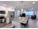 Modern kitchen with stainless steel appliances, granite countertops, and an open layout at 1326 Wildcat Ct, Apopka, FL 32712