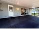 Spacious screened lanai with door and sliding glass doors leading to the interior of the home at 1326 Wildcat Ct, Apopka, FL 32712