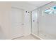 Bathroom with glass enclosed shower, white door and modern fixtures at 14189 Larkspur Lake Dr, Winter Garden, FL 34787