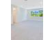 Spacious bedroom with ample natural light, neutral paint, plush carpeting, and large windows with backyard views at 14189 Larkspur Lake Dr, Winter Garden, FL 34787