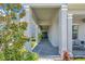 Inviting entryway featuring a covered porch, paved walkway, and lush landscaping at 14189 Larkspur Lake Dr, Winter Garden, FL 34787