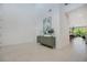 Bright foyer with tile flooring, stylish console table, and view of the dining and living area at 14189 Larkspur Lake Dr, Winter Garden, FL 34787