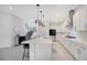 Modern kitchen with stainless steel appliances, white cabinetry, and a large island with pendant lighting at 14189 Larkspur Lake Dr, Winter Garden, FL 34787