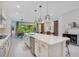 Open concept kitchen with a large island, stainless steel appliances, and views of the living and dining areas at 14189 Larkspur Lake Dr, Winter Garden, FL 34787