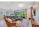 Bright living room with access to outdoor patio, comfortable seating, and modern decor at 14189 Larkspur Lake Dr, Winter Garden, FL 34787