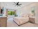 Relaxing main bedroom with large windows, soft natural light and plush bedding at 14189 Larkspur Lake Dr, Winter Garden, FL 34787