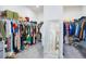 Spacious walk-in closet with ample shelving and hanging space for organized storage at 14189 Larkspur Lake Dr, Winter Garden, FL 34787