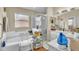 Bright bathroom featuring tub, large window, separate shower, vanity, and tile floors at 14654 Lady Victoria Blvd, Orlando, FL 32826