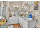 Large bathroom featuring double sinks, tile floors, and large mirrors with great lighting at 14654 Lady Victoria Blvd, Orlando, FL 32826