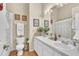 Bright bathroom featuring double sinks with tile flooring and shower and tub combo at 14654 Lady Victoria Blvd, Orlando, FL 32826