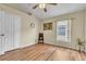 This spacious bedroom offers wood-look flooring, a ceiling fan, and a large closet for storage at 14654 Lady Victoria Blvd, Orlando, FL 32826