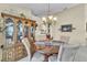 Dining room with a round dining table set for four and a china cabinet at 14654 Lady Victoria Blvd, Orlando, FL 32826