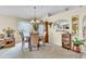 Cozy dining room with a chandelier, a china cabinet, and neutral walls at 14654 Lady Victoria Blvd, Orlando, FL 32826
