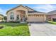 Charming single-Gathering home featuring a well-manicured lawn, attached two-car garage, and inviting front entrance at 14654 Lady Victoria Blvd, Orlando, FL 32826