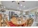 Bright kitchen with stainless steel appliances and an adjacent dining area with wood table and colorful chairs at 14654 Lady Victoria Blvd, Orlando, FL 32826