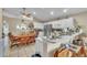 Kitchen with a breakfast bar and an adjacent dining space, equipped with modern appliances at 14654 Lady Victoria Blvd, Orlando, FL 32826