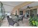The enclosed lanai boasts tile flooring, a ceiling fan, and views of the landscaped backyard at 14654 Lady Victoria Blvd, Orlando, FL 32826