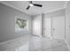 Bedroom featuring marble floors, light colored walls, and dual closets at 1706 Cheltenborough Dr, Orlando, FL 32835