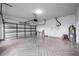 Bright and spacious garage with clean epoxy flooring and brick paved driveway at 1706 Cheltenborough Dr, Orlando, FL 32835