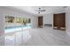 Bright living room features large sliding glass doors, modern fireplace, and marble floors at 1706 Cheltenborough Dr, Orlando, FL 32835