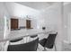 Living room showcasing a breakfast bar, modern fireplace, and large sliding doors at 1706 Cheltenborough Dr, Orlando, FL 32835