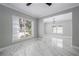 Inviting living room featuring marble floors, large windows, and modern lighting fixtures at 1706 Cheltenborough Dr, Orlando, FL 32835