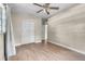 Bedroom with hardwood floors, large closet, and base trim at 1711 37Th St, Orlando, FL 32839