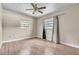 Bedroom with hardwood flooring, base trim, and two windows at 1711 37Th St, Orlando, FL 32839