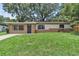 Charming single-story home features a well-maintained lawn and a cozy, inviting exterior at 1711 37Th St, Orlando, FL 32839
