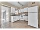 Functional kitchen with white cabinets, neutral counters, and white appliances ready for updates at 1711 37Th St, Orlando, FL 32839