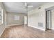 Bright living room showcasing a ceiling fan, window, and neutral paint ready for decor at 1711 37Th St, Orlando, FL 32839