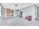Open-concept living area with tile flooring and sliding wood door at 1711 37Th St, Orlando, FL 32839