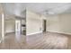 Open living room featuring tile and wood-look floors, a ceiling fan, and neutral walls at 1711 37Th St, Orlando, FL 32839