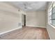 Spacious living room with natural light, ceiling fan and neutral walls ready for decor at 1711 37Th St, Orlando, FL 32839