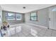 Living room with tile floors featuring windows and front door at 1711 37Th St, Orlando, FL 32839