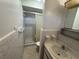 Bright bathroom featuring a shower with glass door, a toilet and sink with vanity at 1730 Oneco Ave, Winter Park, FL 32789