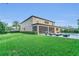 Lush green backyard with a screened lanai, a private pool, and comfortable lounge chairs at 1938 Filly Trl, Oviedo, FL 32765