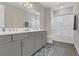 Bathroom features a double sink vanity, subway tile in the shower, and wood look flooring at 1938 Filly Trl, Oviedo, FL 32765