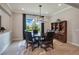 Dining room with large windows for natural light, a decorative light fixture, and a built-in cabinet at 1938 Filly Trl, Oviedo, FL 32765