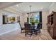 Elegant dining room with a chandelier, wood table, and comfortable chairs, perfect for gatherings at 1938 Filly Trl, Oviedo, FL 32765