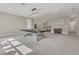 A spacious game room with neutral paint, carpeting, a modern ping pong table and recessed lighting at 1938 Filly Trl, Oviedo, FL 32765